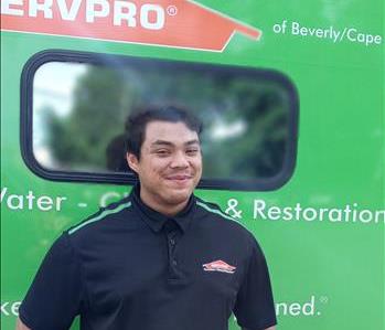 kevin is smiling infront of our SERVPRO Vehicle 