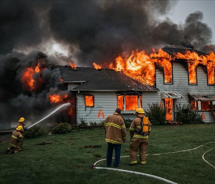 firefighters fighting a house fire